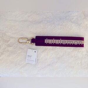 NWT lululemon athletica neverlost keychain Burgundy with bone logo,Gold Hardware